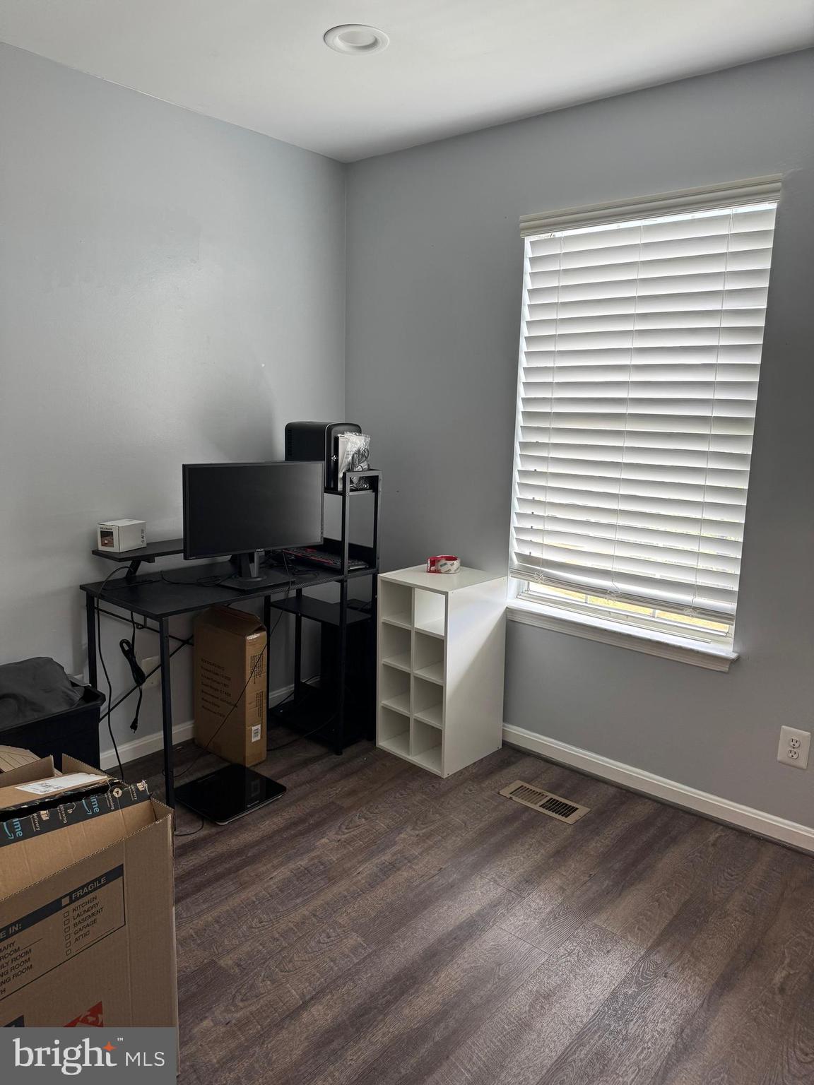 20691 Southwind Terrace Ashburn, VA 20147 - Photo 13 of 16 a kitchen with a stove and wooden floor
