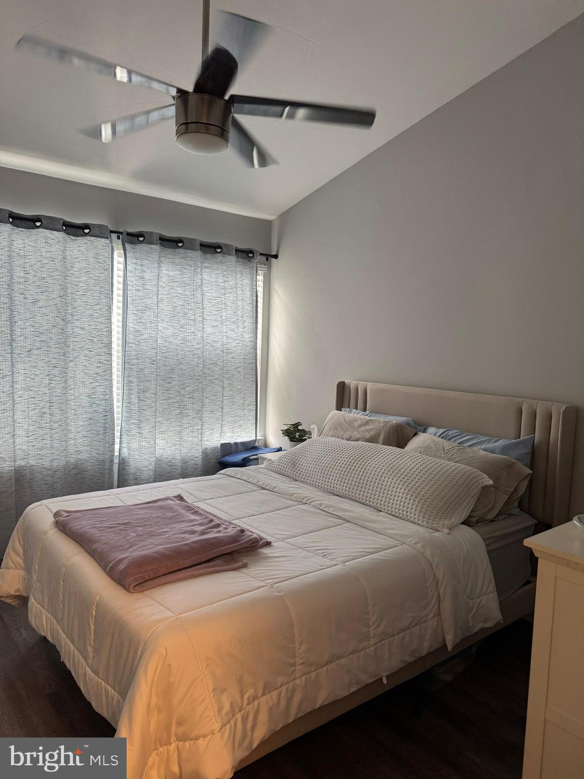 20691 Southwind Terrace Ashburn, VA 20147 - Photo 14 of 16 a bedroom with a bed and a chandelier