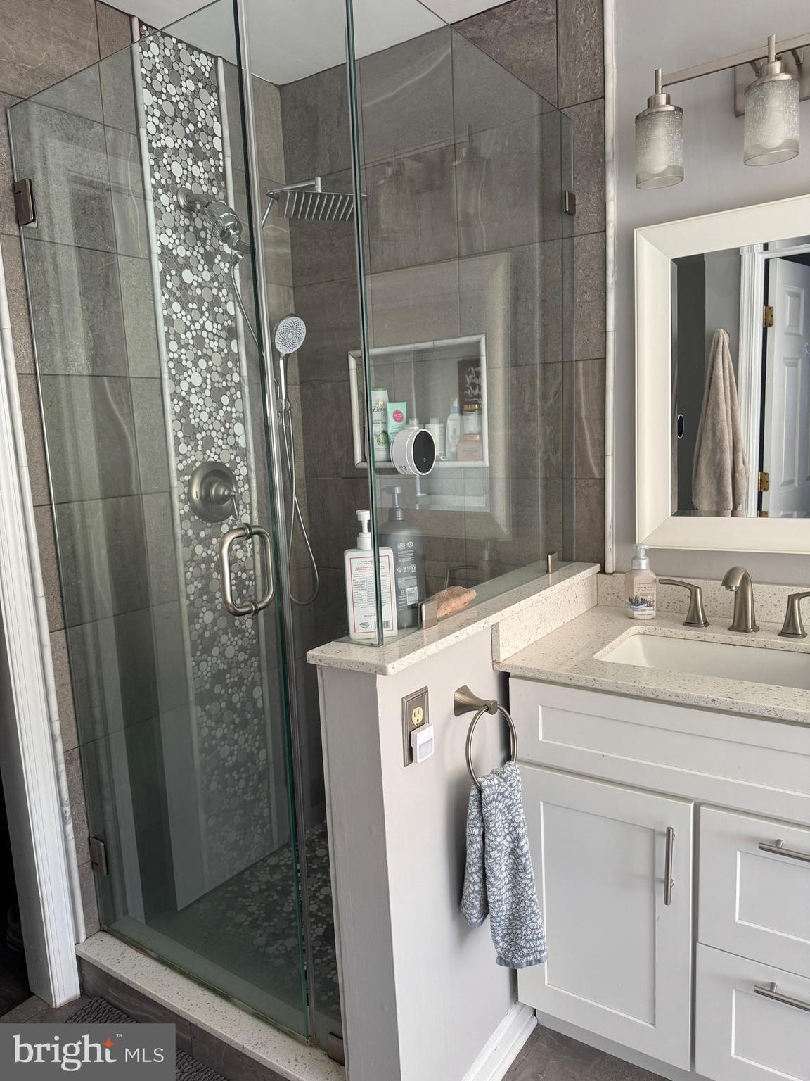 20691 Southwind Terrace Ashburn, VA 20147 - Photo 16 of 16 a bathroom with a sink and mirror