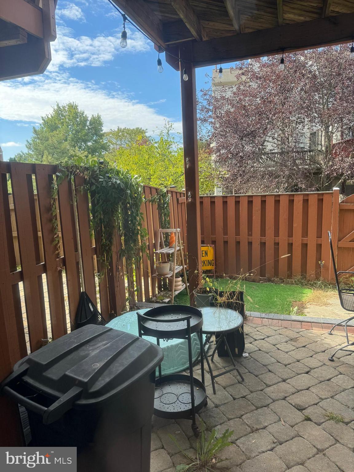20691 Southwind Terrace Ashburn, VA 20147 - Photo 3 of 16 a backyard of a house with table and chairs