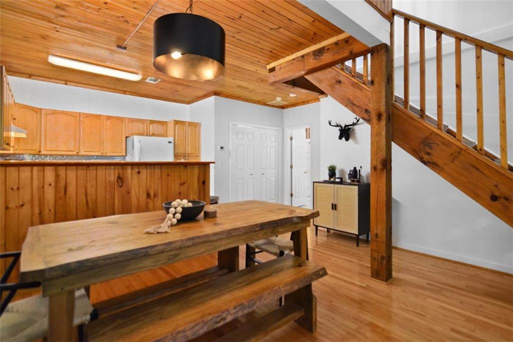 223 Mango Circle Ellijay, GA 30540 - Photo 17 of 43 a view of a dining room with furniture and wooden floor