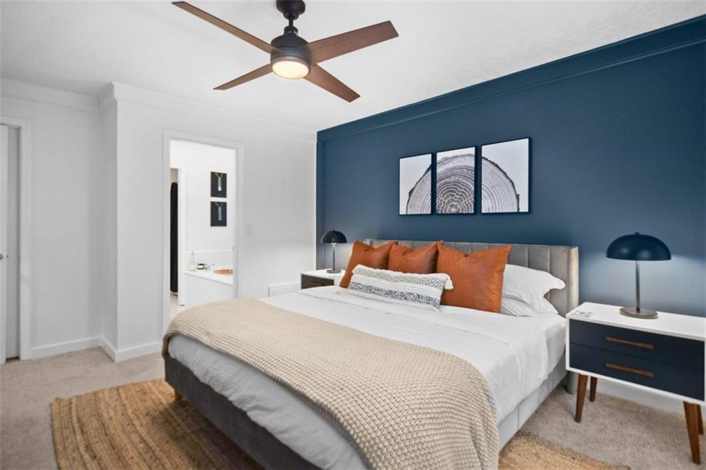 223 Mango Circle Ellijay, GA 30540 - Photo 20 of 43 a bedroom with a bed and a painting on the wall