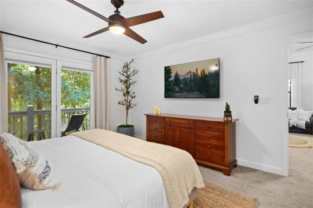 223 Mango Circle Ellijay, GA 30540 - Photo 22 of 43 a bedroom with a bed and a flat screen tv