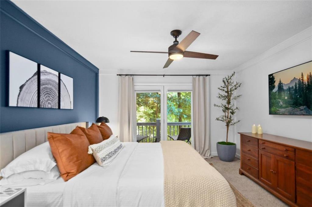 223 Mango Circle Ellijay, GA 30540 - Photo 23 of 43 a bedroom with a large bed and a window