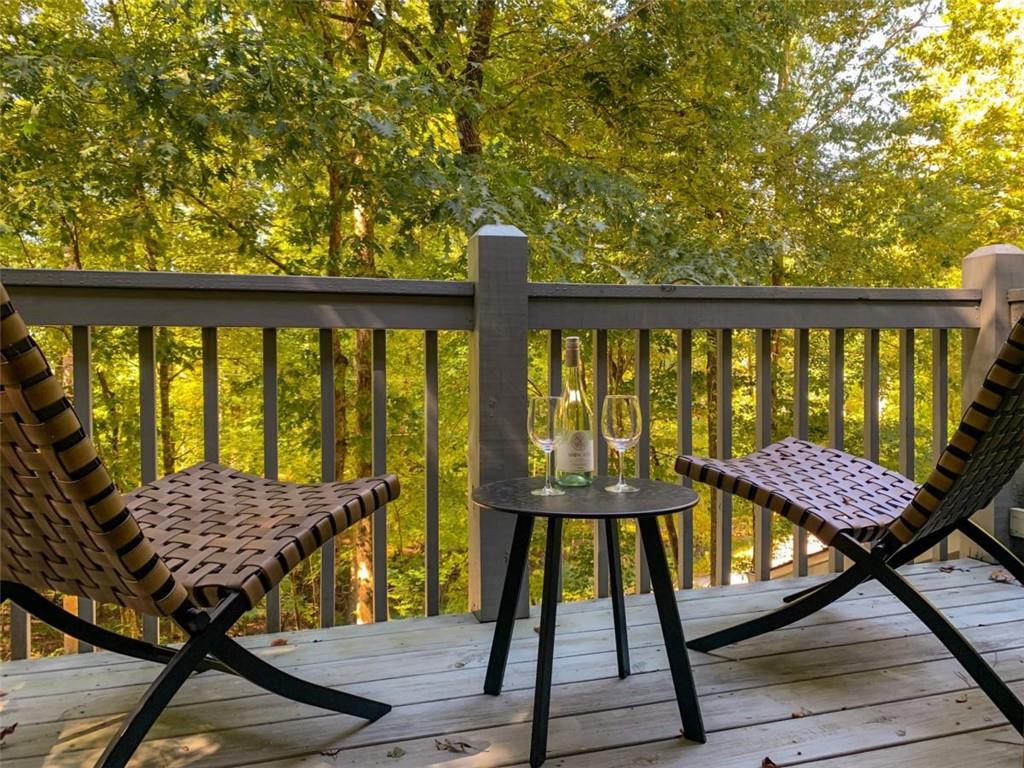 223 Mango Circle Ellijay, GA 30540 - Photo 24 of 43 a view of a balcony with wooden floor and outdoor seating