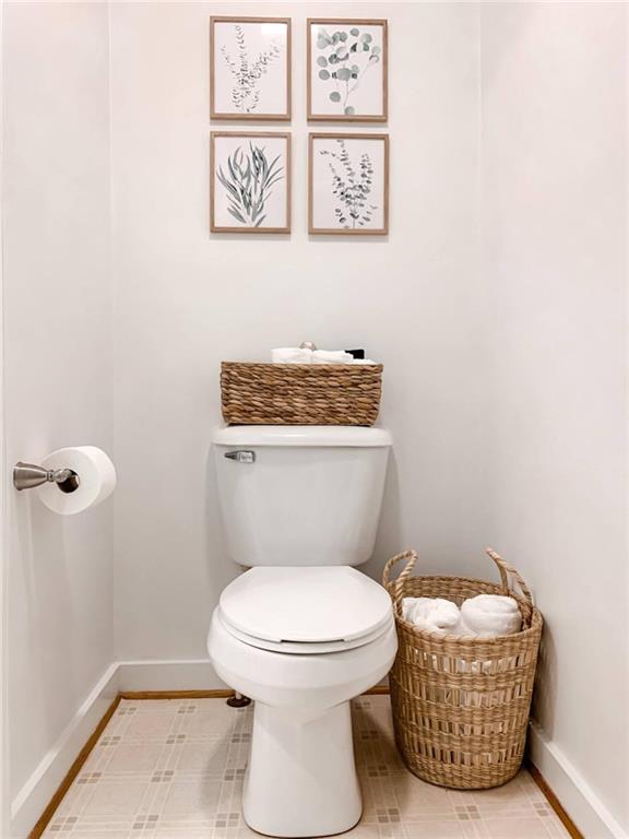 223 Mango Circle Ellijay, GA 30540 - Photo 27 of 43 a bathroom with a toilet a sink and mirror