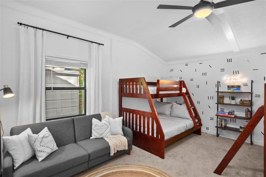 223 Mango Circle Ellijay, GA 30540 - Photo 29 of 43 a bedroom with furniture and a wooden floor