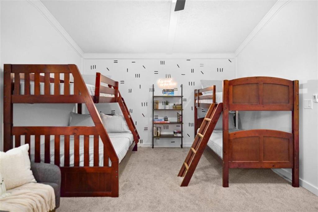 223 Mango Circle Ellijay, GA 30540 - Photo 31 of 43 a bedroom with furniture and a wooden floor