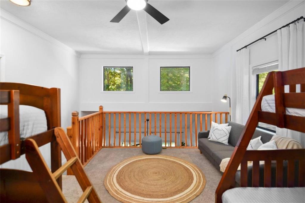 223 Mango Circle Ellijay, GA 30540 - Photo 32 of 43 a bathroom with a toilet a sink and a mirror