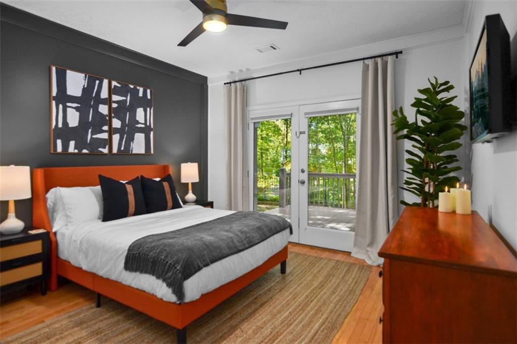 223 Mango Circle Ellijay, GA 30540 - Photo 33 of 43 a bedroom with a large bed and a large window