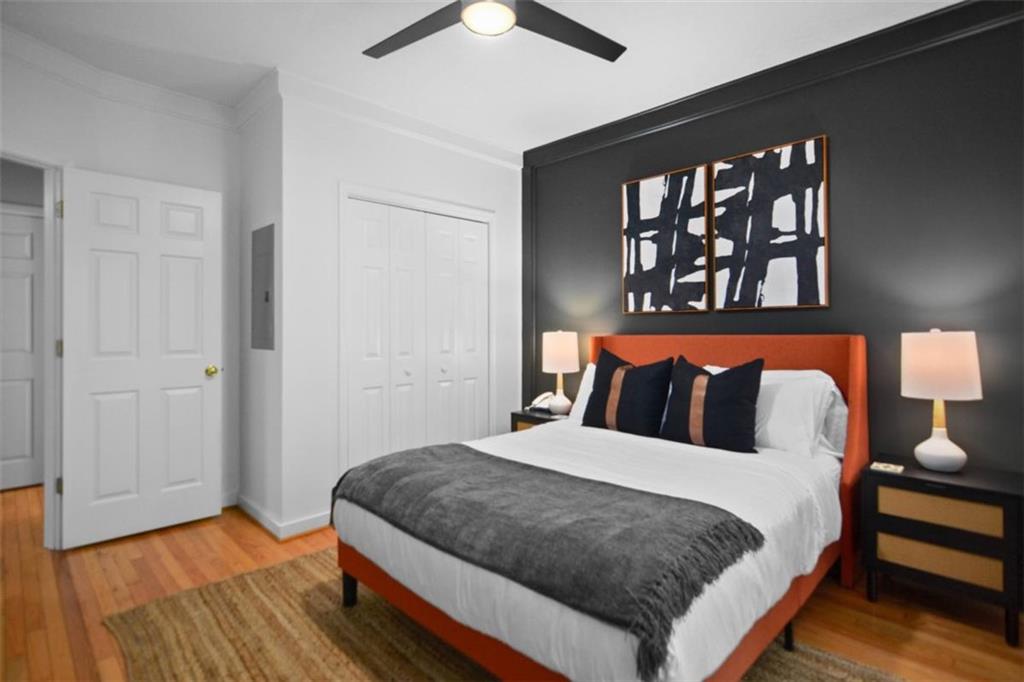 223 Mango Circle Ellijay, GA 30540 - Photo 34 of 43 a bedroom with a bed and a painting on the wall