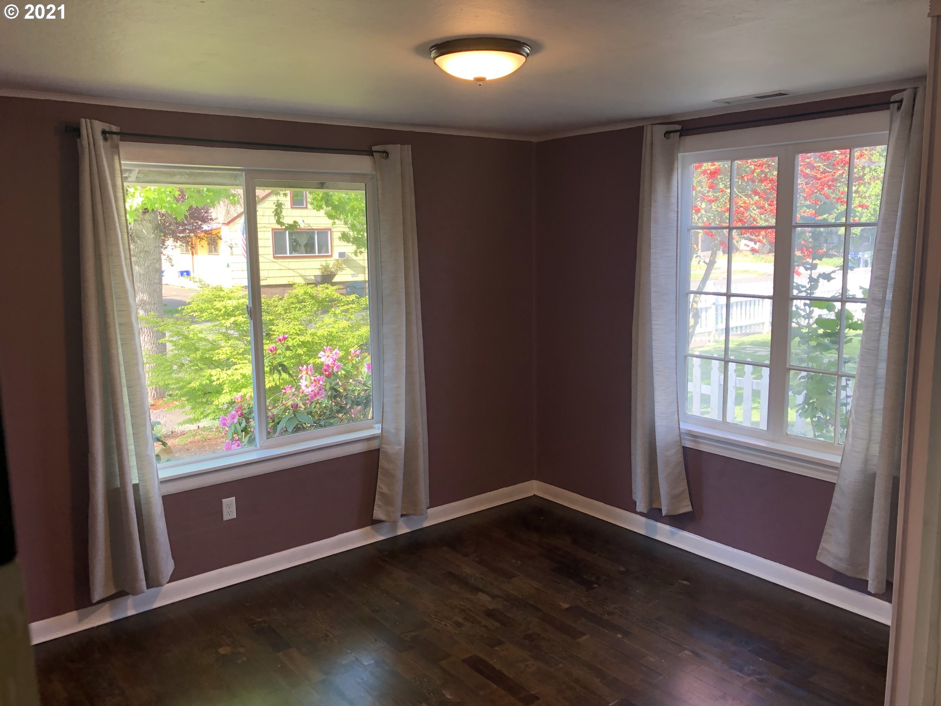 1327 E Street Springfield, OR 97477 - Photo 12 of 32 an empty room with wooden floor and windows