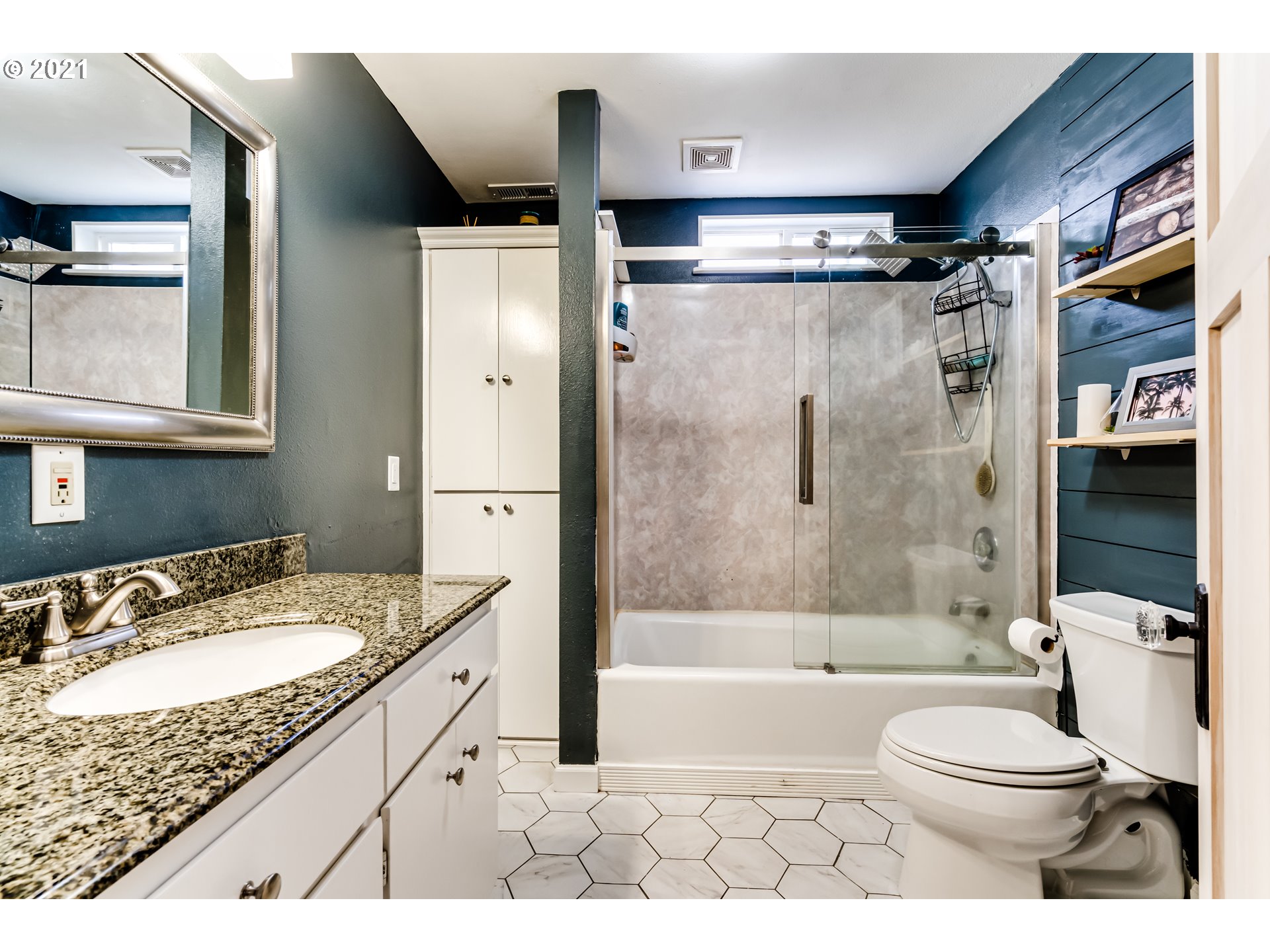 1327 E Street Springfield, OR 97477 - Photo 14 of 32 a bathroom with a granite countertop sink toilet and shower