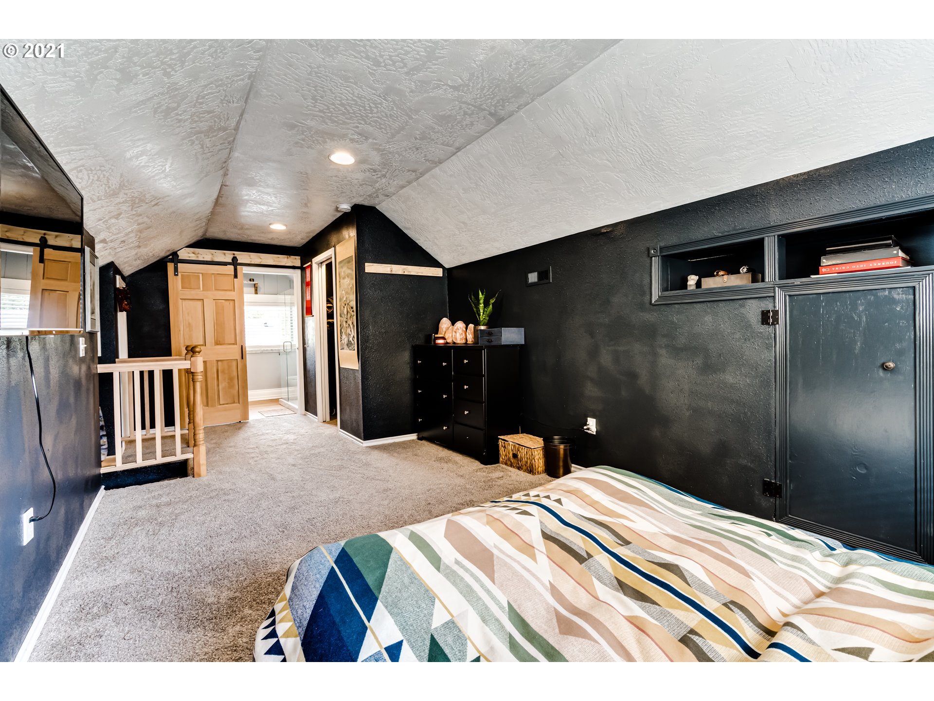 1327 E Street Springfield, OR 97477 - Photo 17 of 32 a bedroom with a bed and a walk in closet
