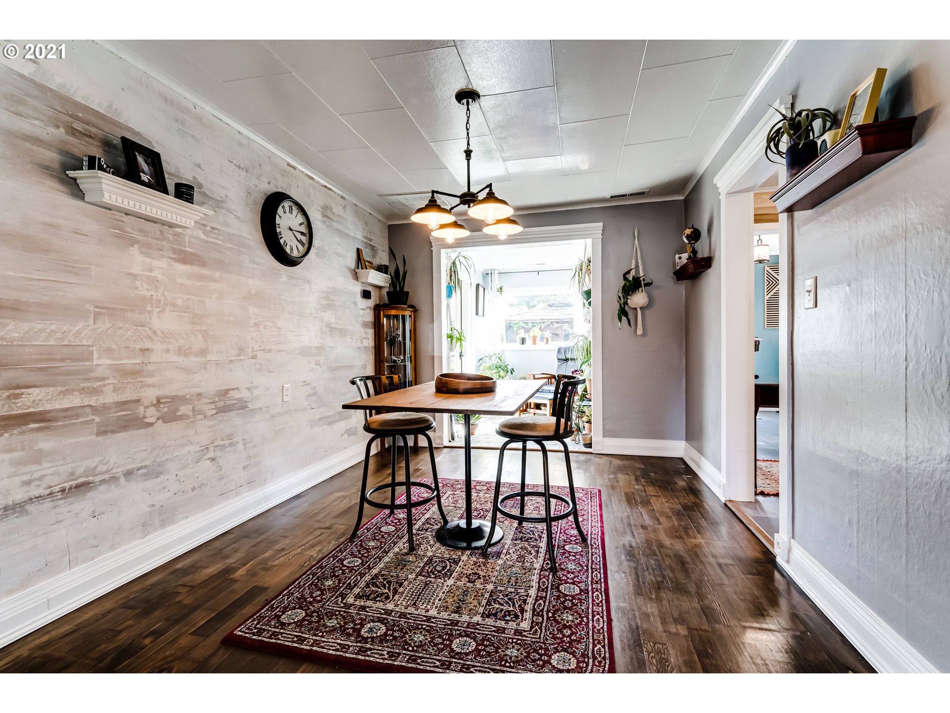 1327 E Street Springfield, OR 97477 - Photo 6 of 32 a view of a dining room with furniture window and wooden floor