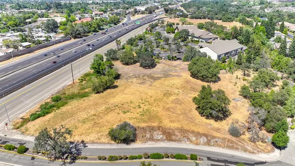 a view of a backyard of the house