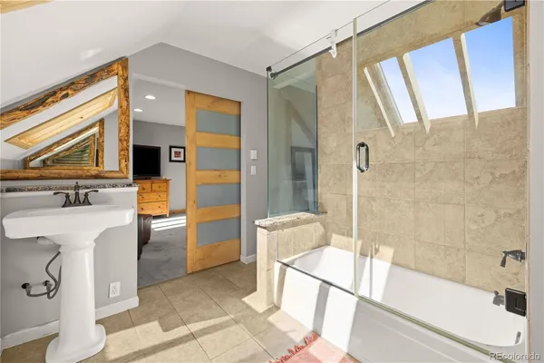a bathroom with a bathtub and a sink