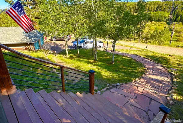 a view of a yard with wooden floor