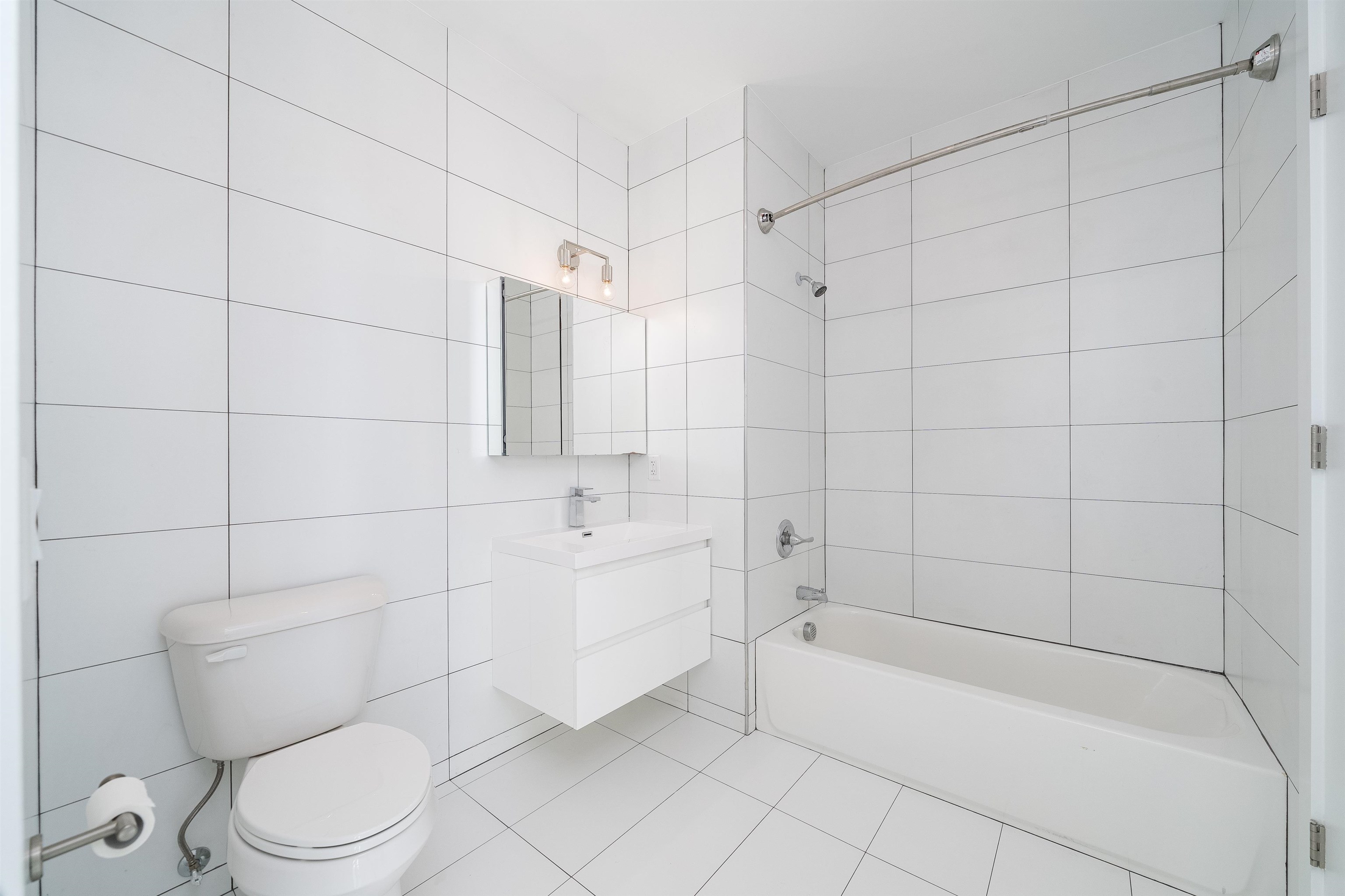 8621 River Road, Unit 4A North Bergen, NJ 07047 - Photo 15 of 42 a bathroom with a toilet and bathtub