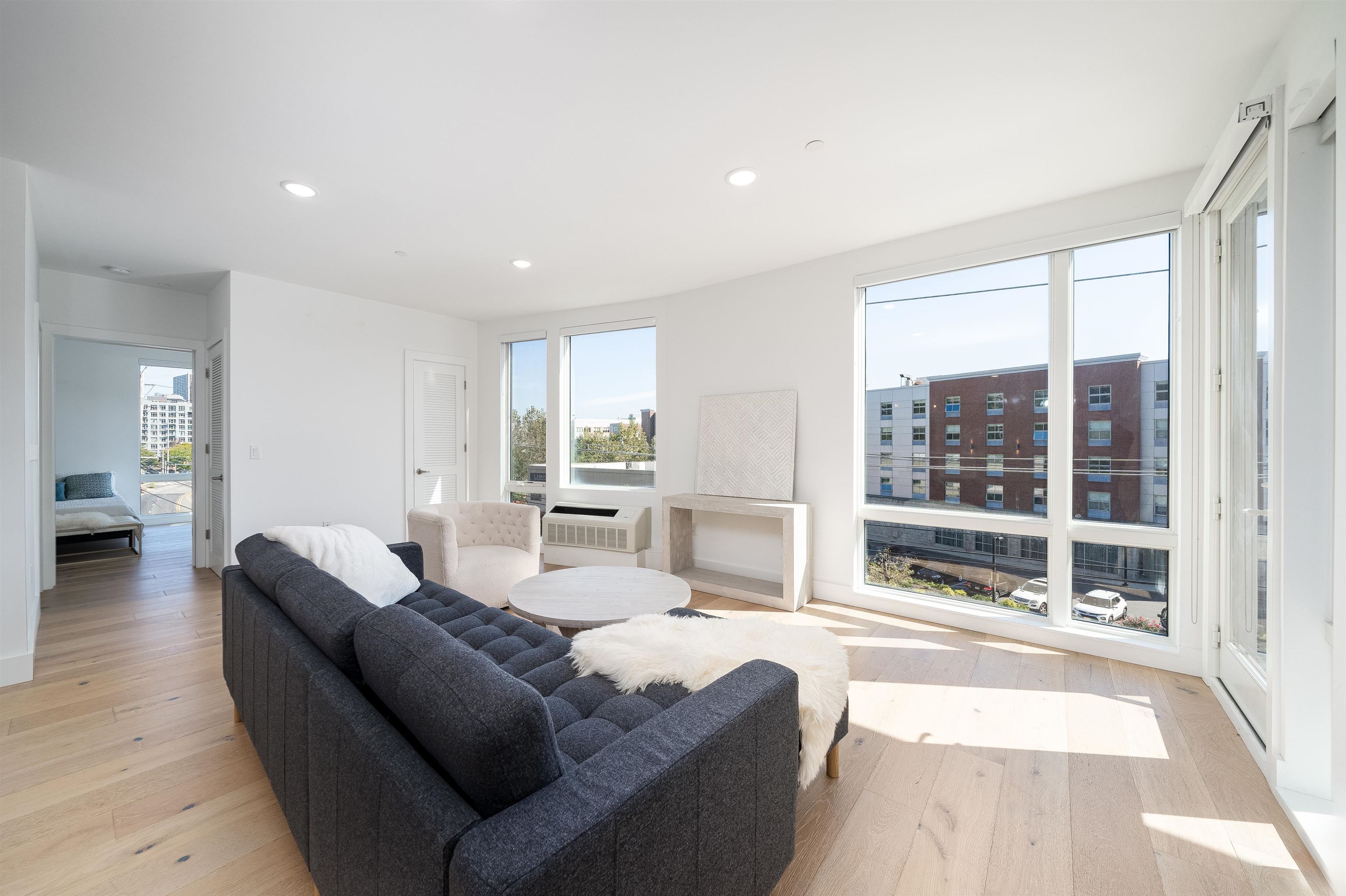 8621 River Road, Unit 4A North Bergen, NJ 07047 - Photo 19 of 42 a living room with furniture and a large window with outer view