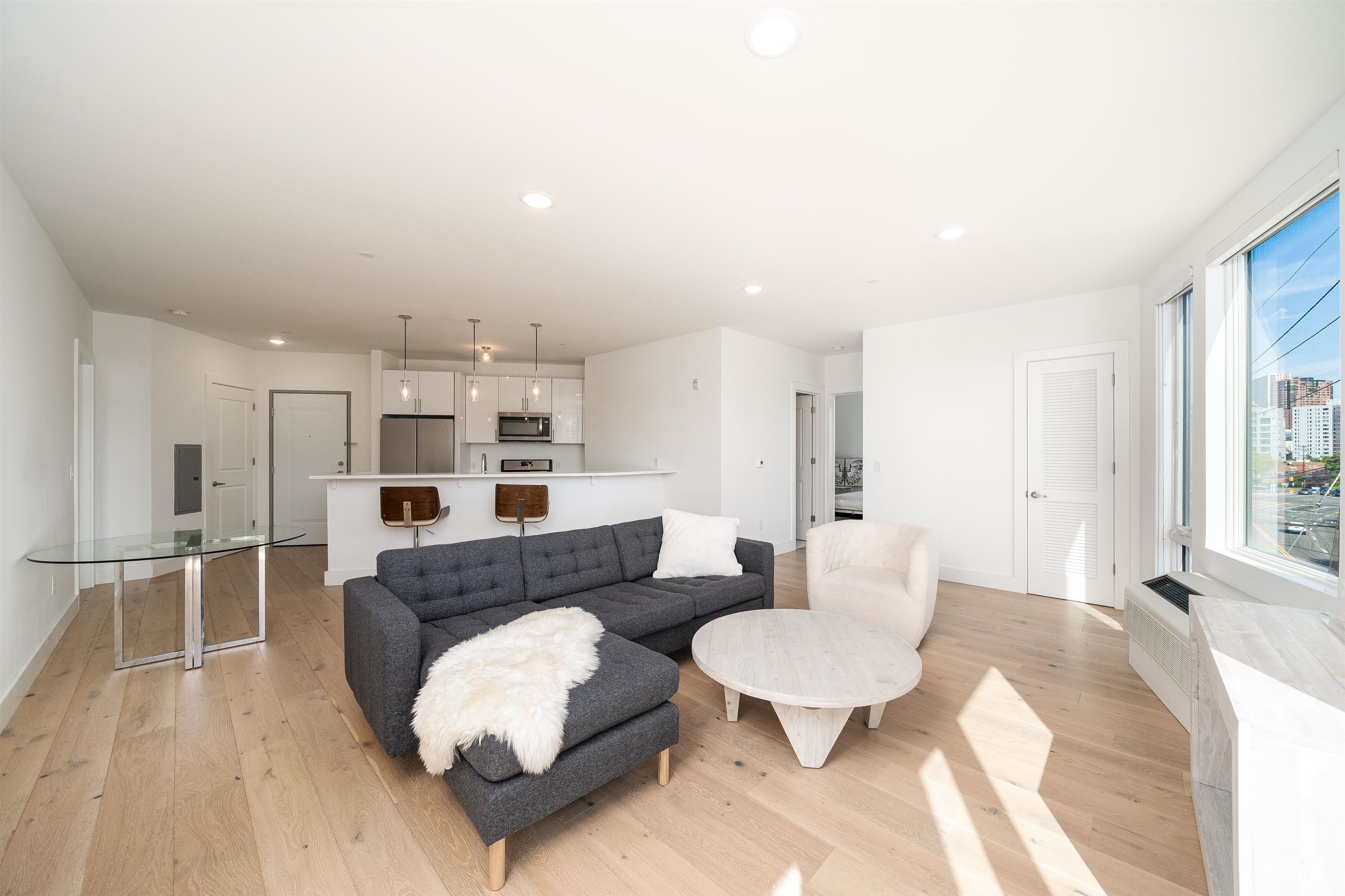 8621 River Road, Unit 4A North Bergen, NJ 07047 - Photo 22 of 42 a living room with furniture and a large window