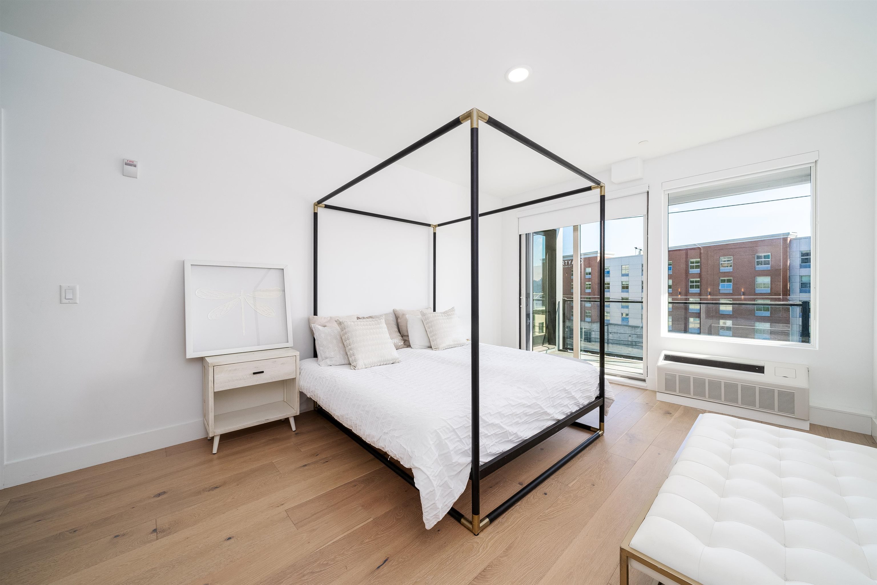 8621 River Road, Unit 4A North Bergen, NJ 07047 - Photo 25 of 42 a bedroom with a bed lamp and a large window