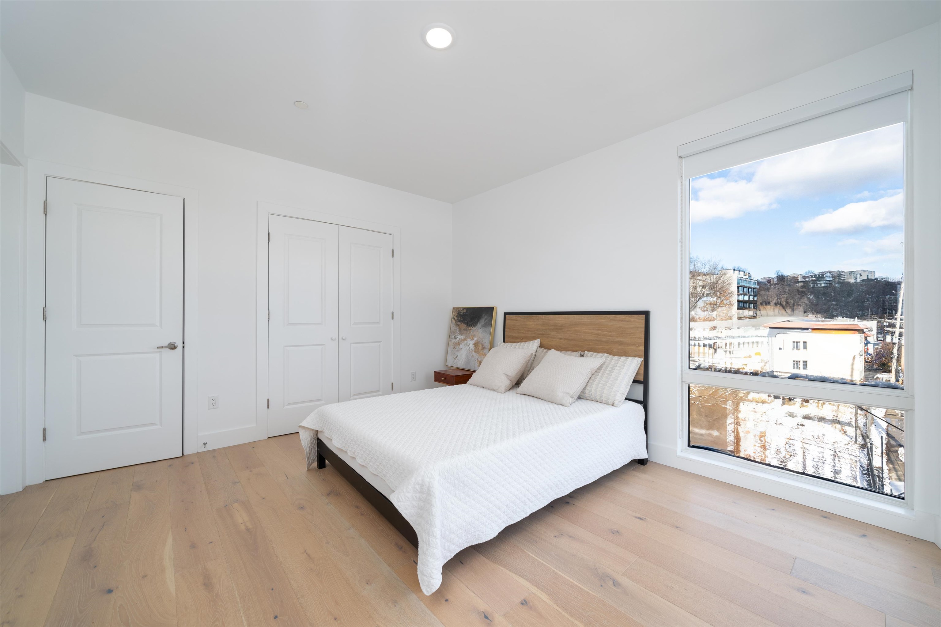 8621 River Road, Unit 4A North Bergen, NJ 07047 - Photo 7 of 42 a bedroom with a large bed and a large window