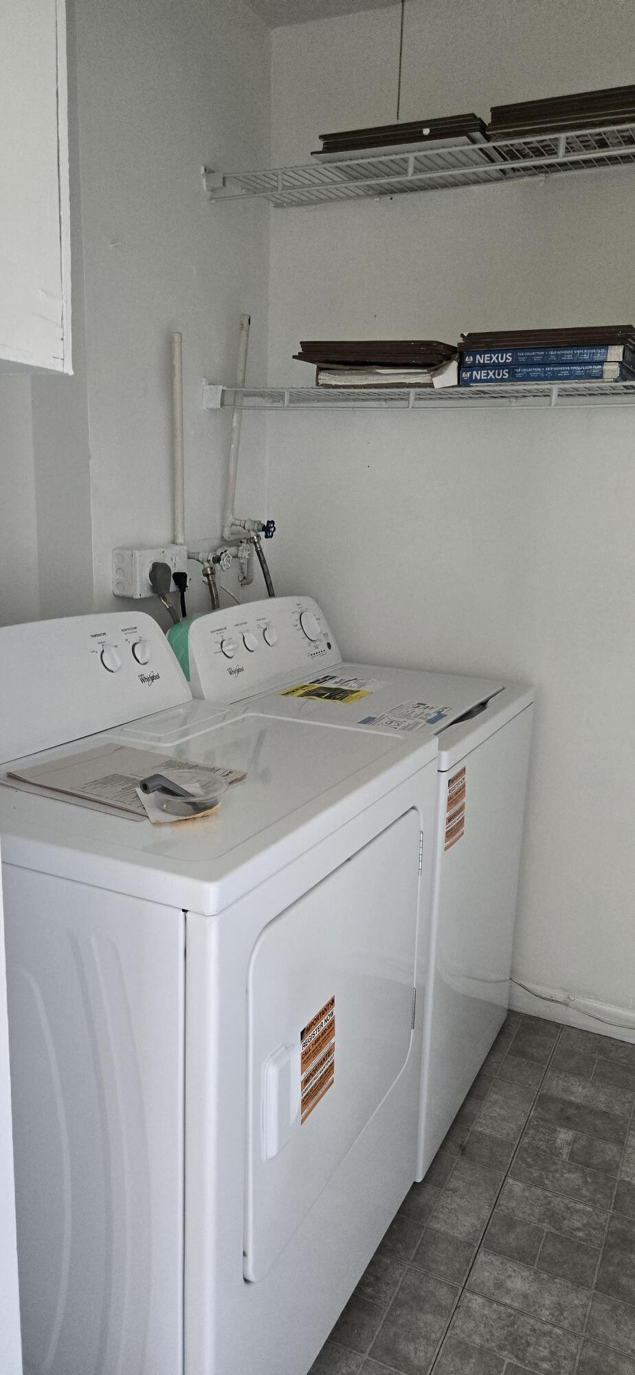 497 Flanders K Delray Beach, FL 33484 - Photo 15 of 15 a utility room with dryer and washer