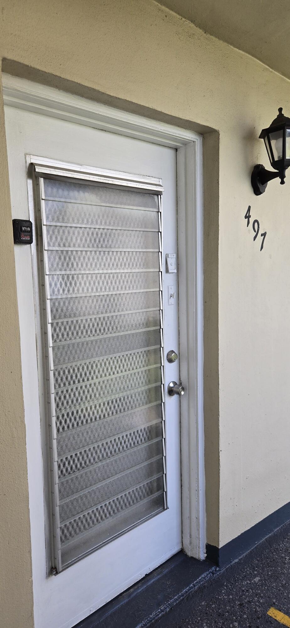 497 Flanders K Delray Beach, FL 33484 - Photo 3 of 15 a bathroom with a glass door