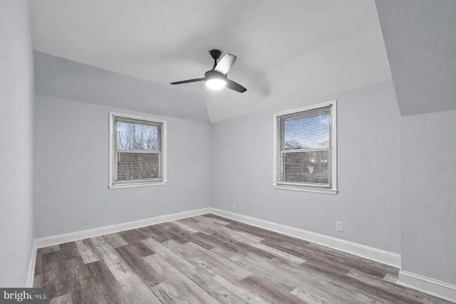 a view of empty room with windows