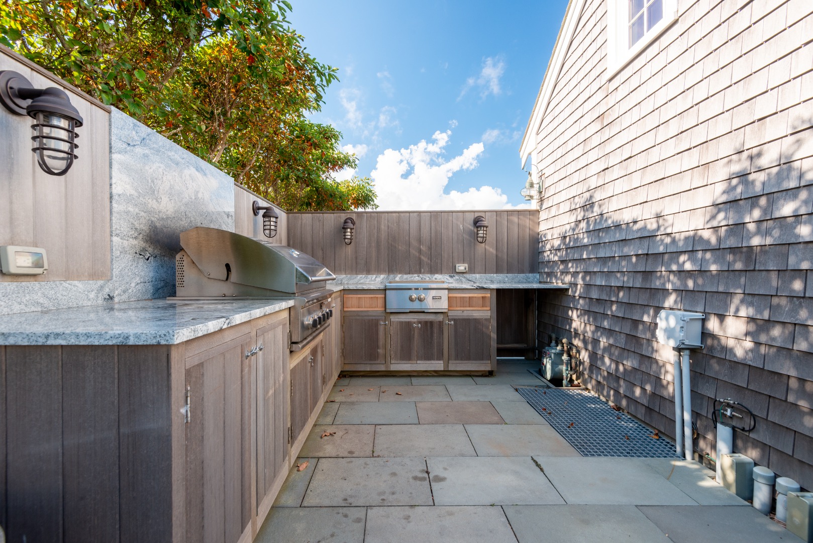 1 Reeds Way Nantucket, MA 02554 - Photo 7 of 51 a kitchen with a stove kitchen island wooden cabinets and entryway