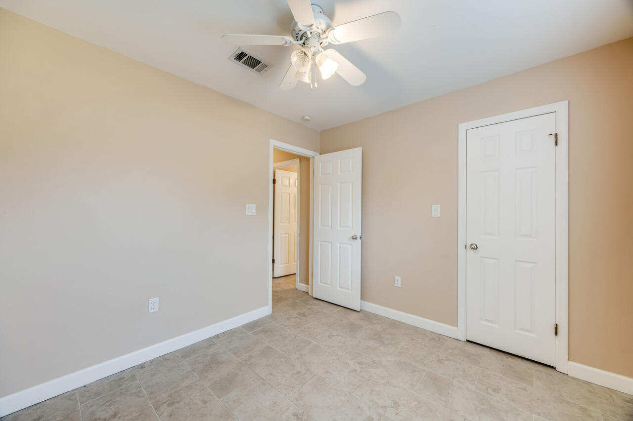519 Krest Drive Crestview, FL 32536 - Photo 23 of 37 a view of an empty room and chandelier fan
