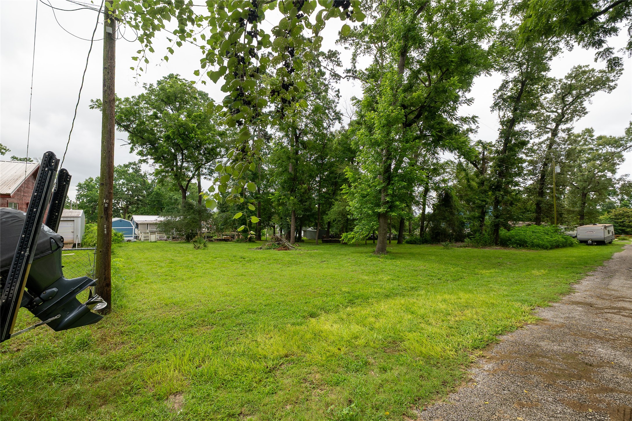 0 Walnut Lane Point Blank, TX 77364 - Photo 6 of 11 Street view from a different angle. Space for one or two homes, depending on your plans.