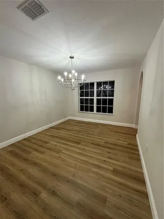 a stove top oven sitting inside of a kitchen