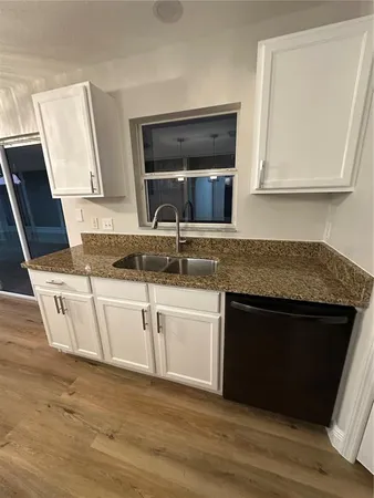 a white toilet sitting next to a white sink