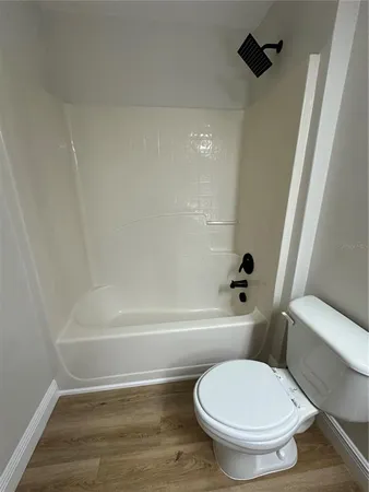 a bathroom with a shower and a toilet