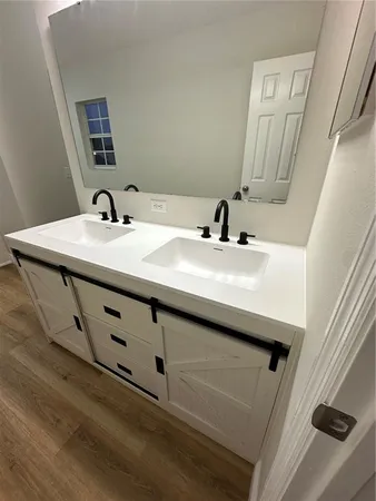 a view of an empty room with a window and fireplace