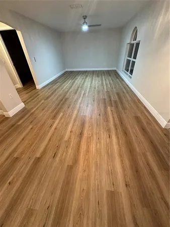 a kitchen with a refrigerator and a stove top oven