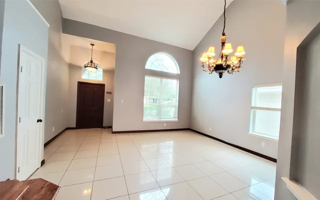 a view of a house with backyard and garden