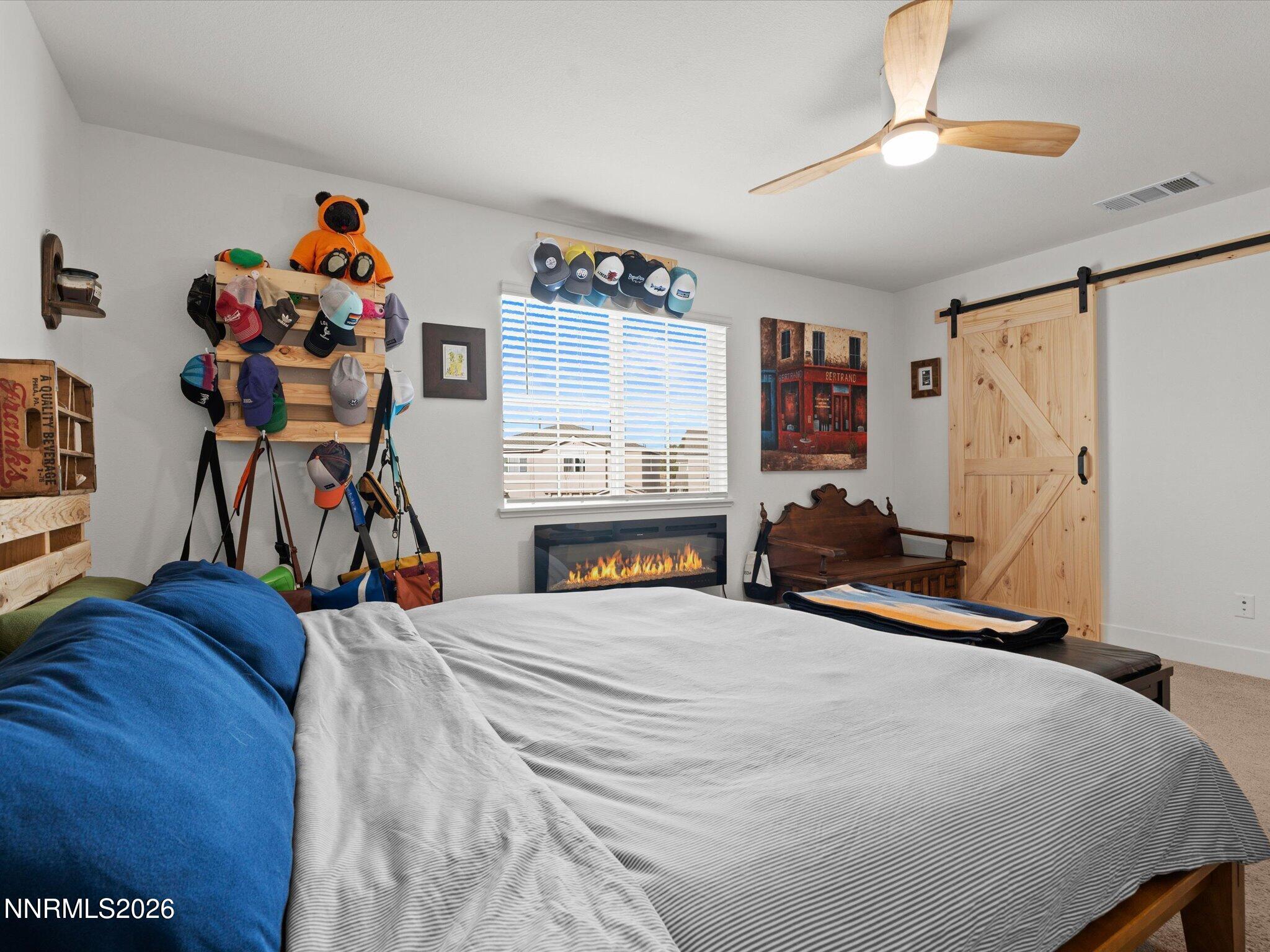 4233 Fawnridge Place Reno, NV 89523 - Photo 17 of 30 a bedroom with bed and wooden floor