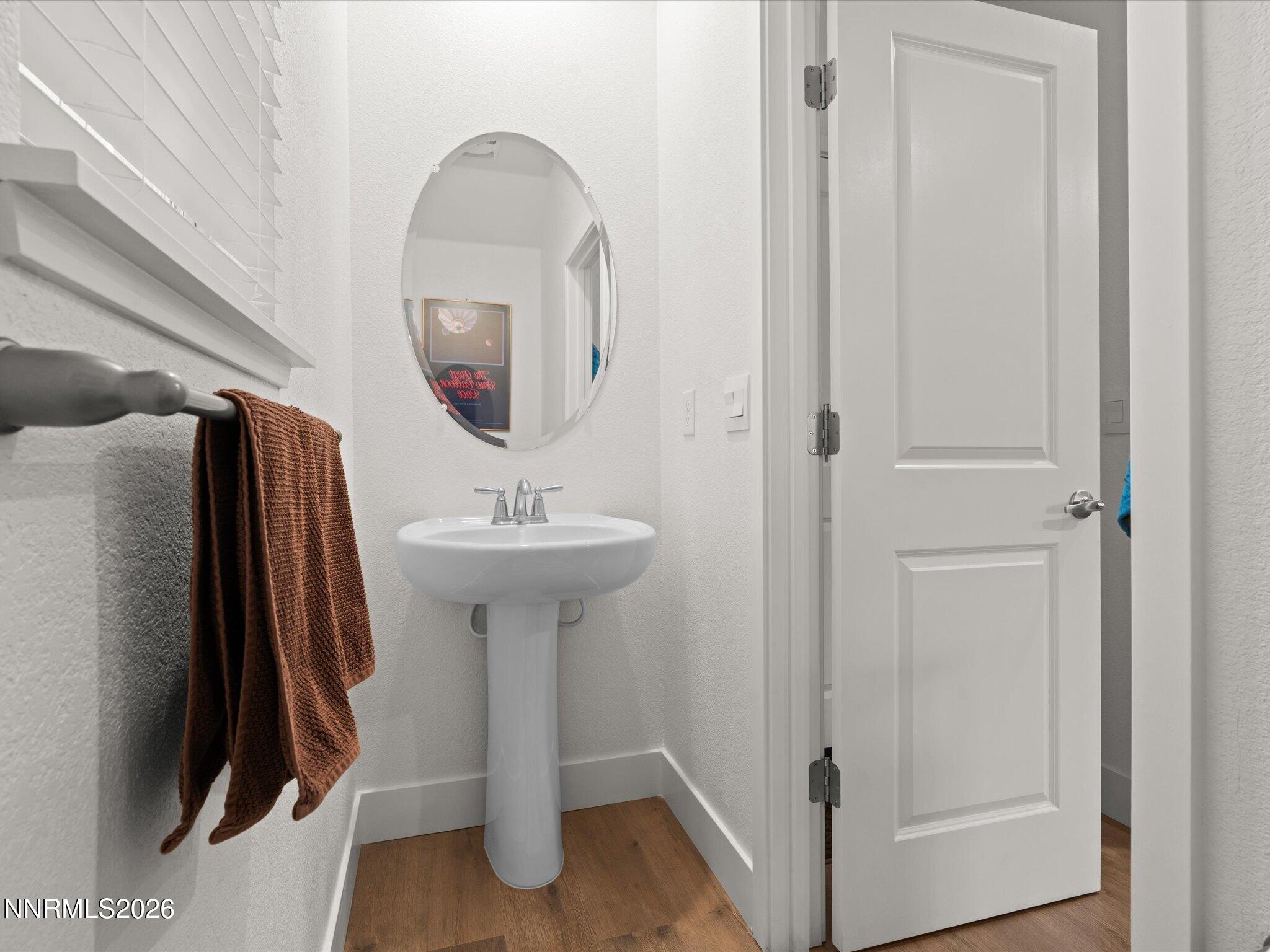 4233 Fawnridge Place Reno, NV 89523 - Photo 23 of 30 a bathroom with a sink and a mirror
