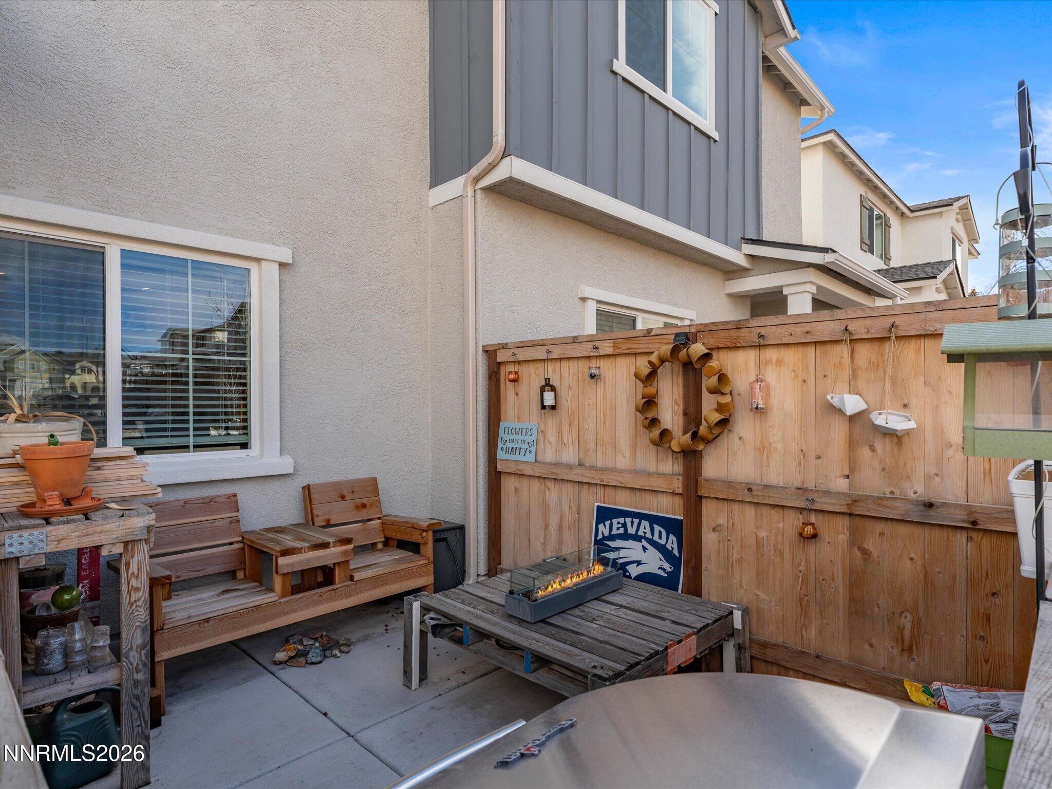 4233 Fawnridge Place Reno, NV 89523 - Photo 26 of 30 a backyard of a house with barbeque oven table and chairs