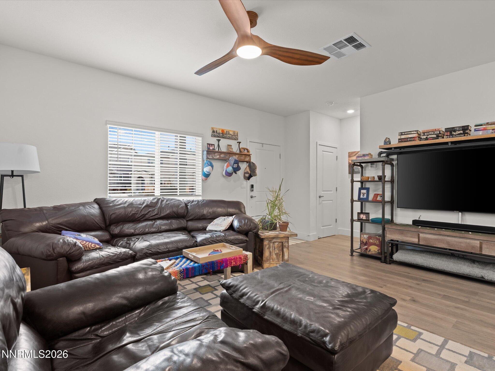 4233 Fawnridge Place Reno, NV 89523 - Photo 4 of 30 a living room with furniture and a flat screen tv