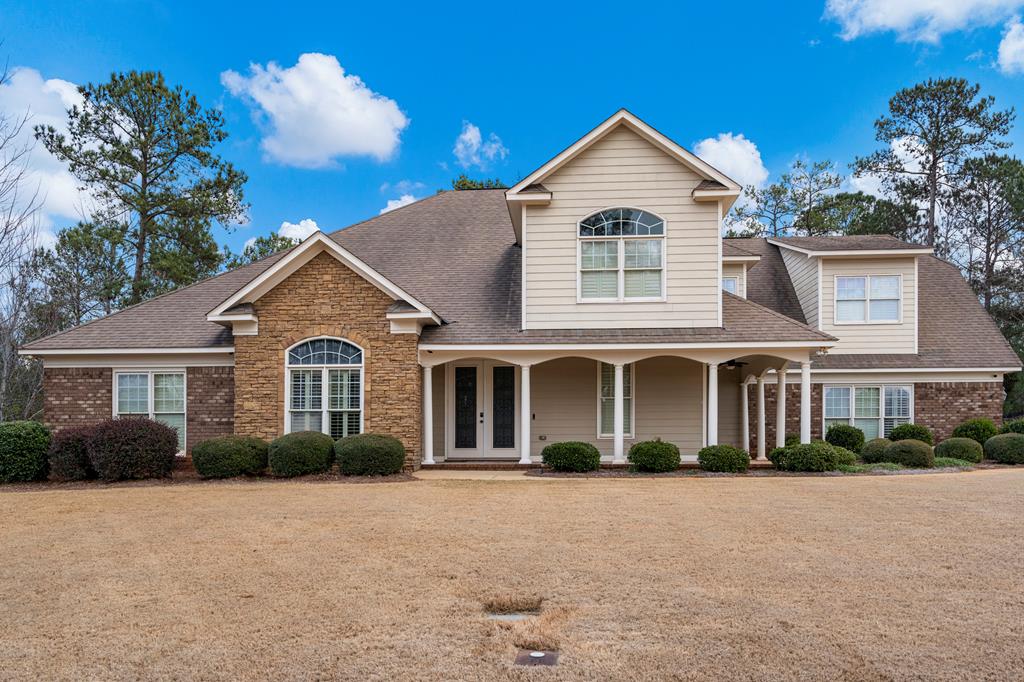 8026 Splendor Way Columbus, GA 31904 - Photo 1 of 44 a front view of a house with a yard and garage