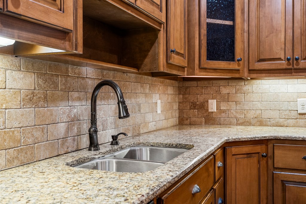 8026 Splendor Way Columbus, GA 31904 - Photo 14 of 44 a kitchen with a sink and cabinets