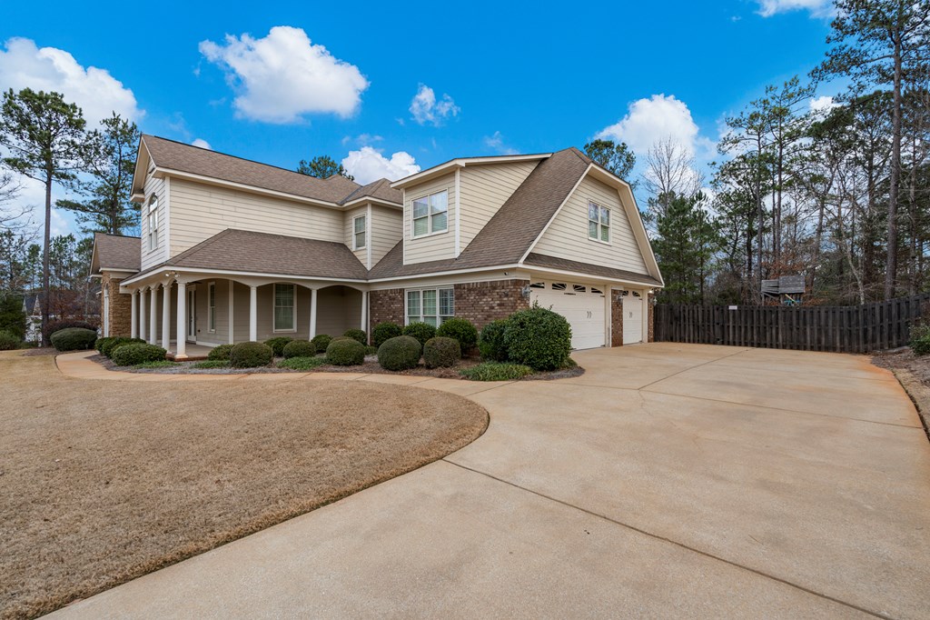 8026 Splendor Way Columbus, GA 31904 - Photo 2 of 44 a front view of a house with a yard and garage