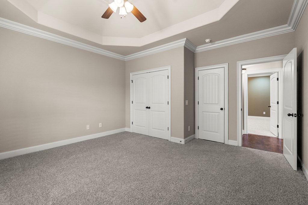 8026 Splendor Way Columbus, GA 31904 - Photo 21 of 44 an empty room with ceiling fan and window