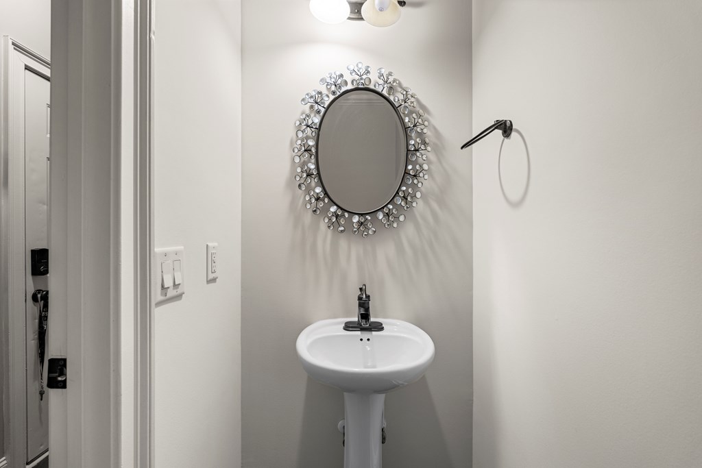 8026 Splendor Way Columbus, GA 31904 - Photo 25 of 44 a bathroom with a sink and a mirror