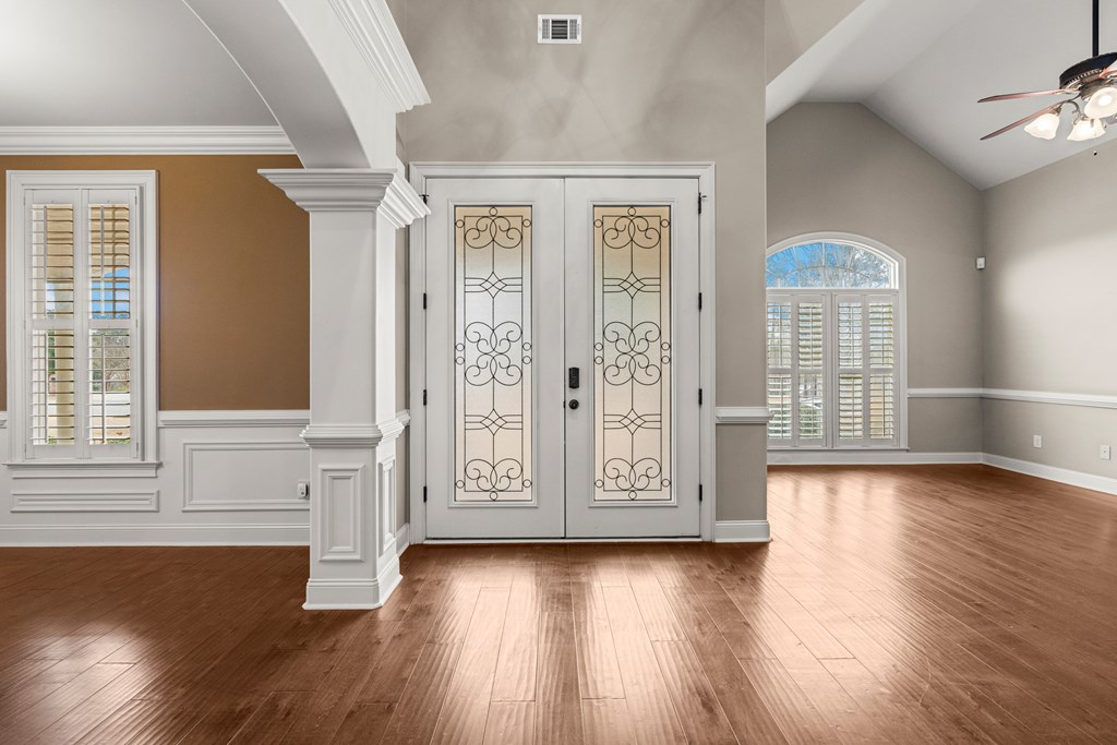 8026 Splendor Way Columbus, GA 31904 - Photo 3 of 44 an empty room with wooden floor and windows