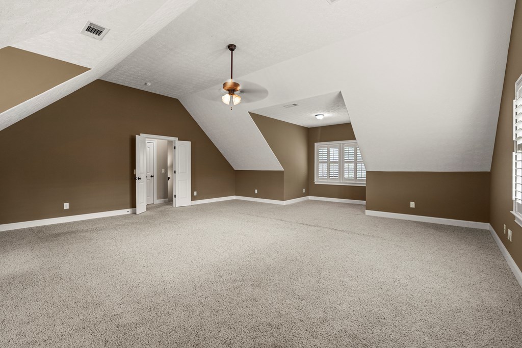 8026 Splendor Way Columbus, GA 31904 - Photo 35 of 44 an empty room with window and stairs